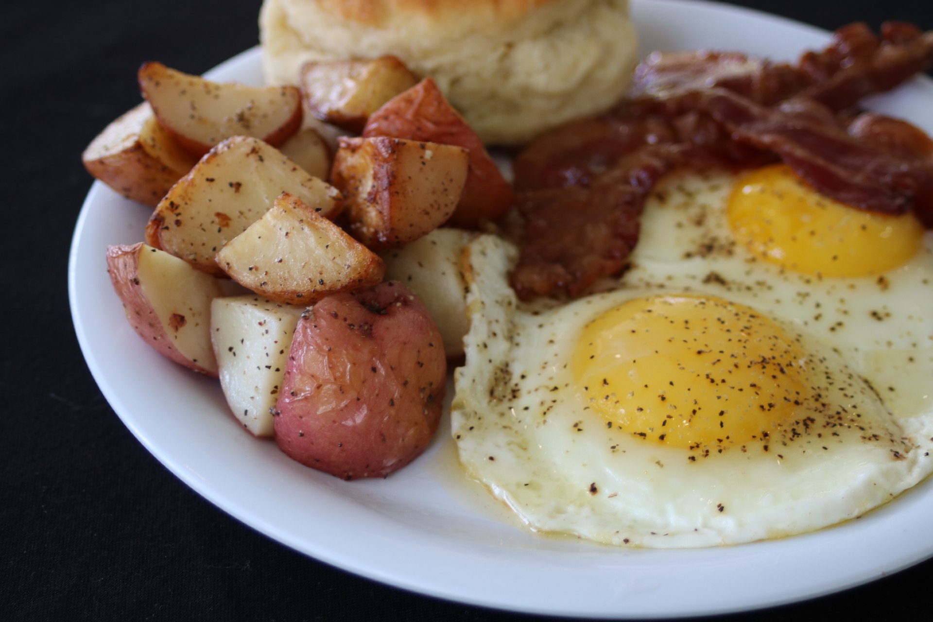 fried eggs, potatoes and bacon